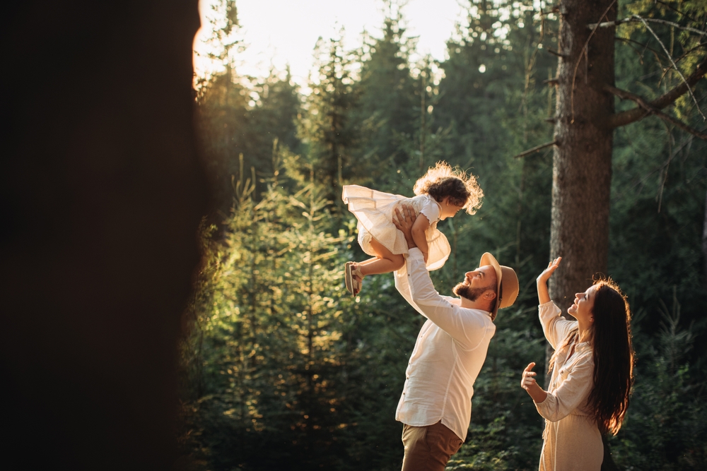 Young,Happy,Family,Playing,In,Sunny,Mountains